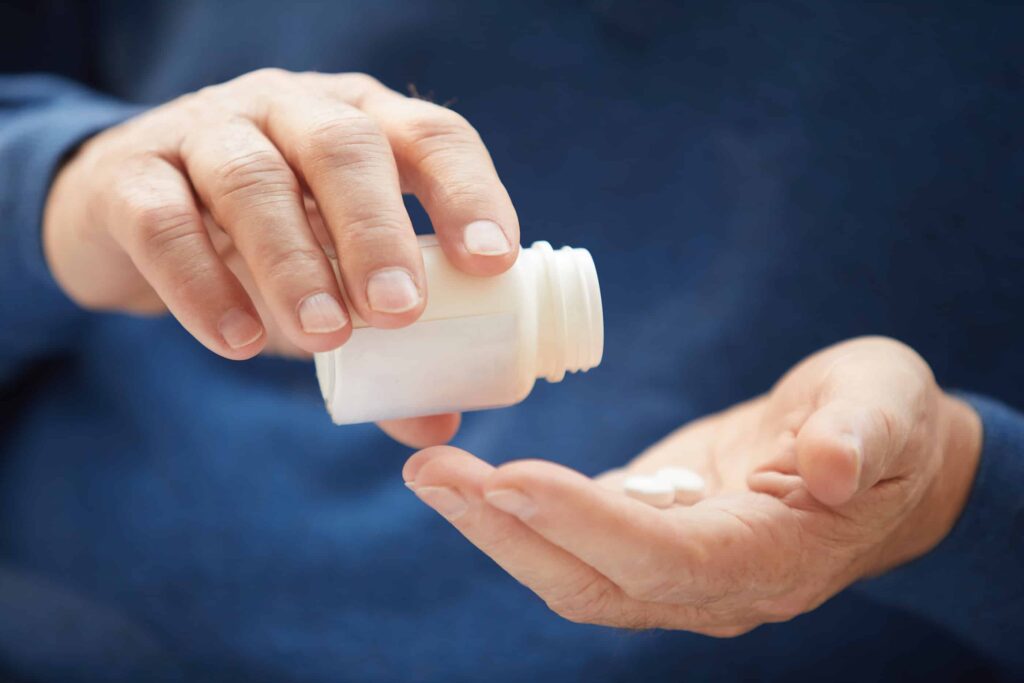 man taking prescription opioids to self-medicate substance use and mental health disorders