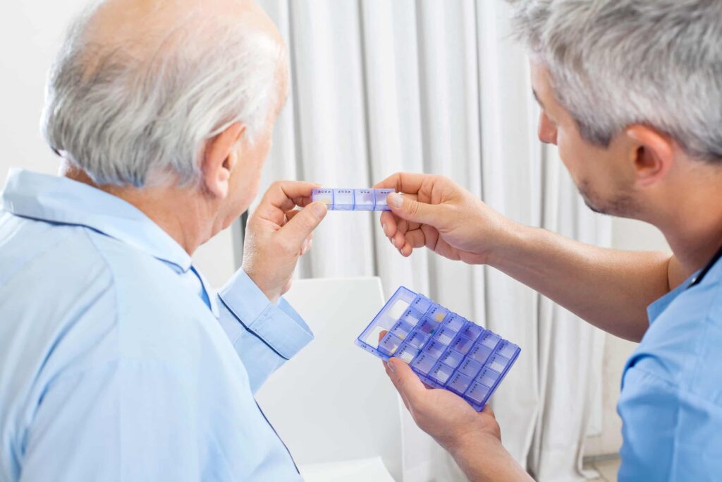 senior with opioid use disorder discusses pain medications with doctor